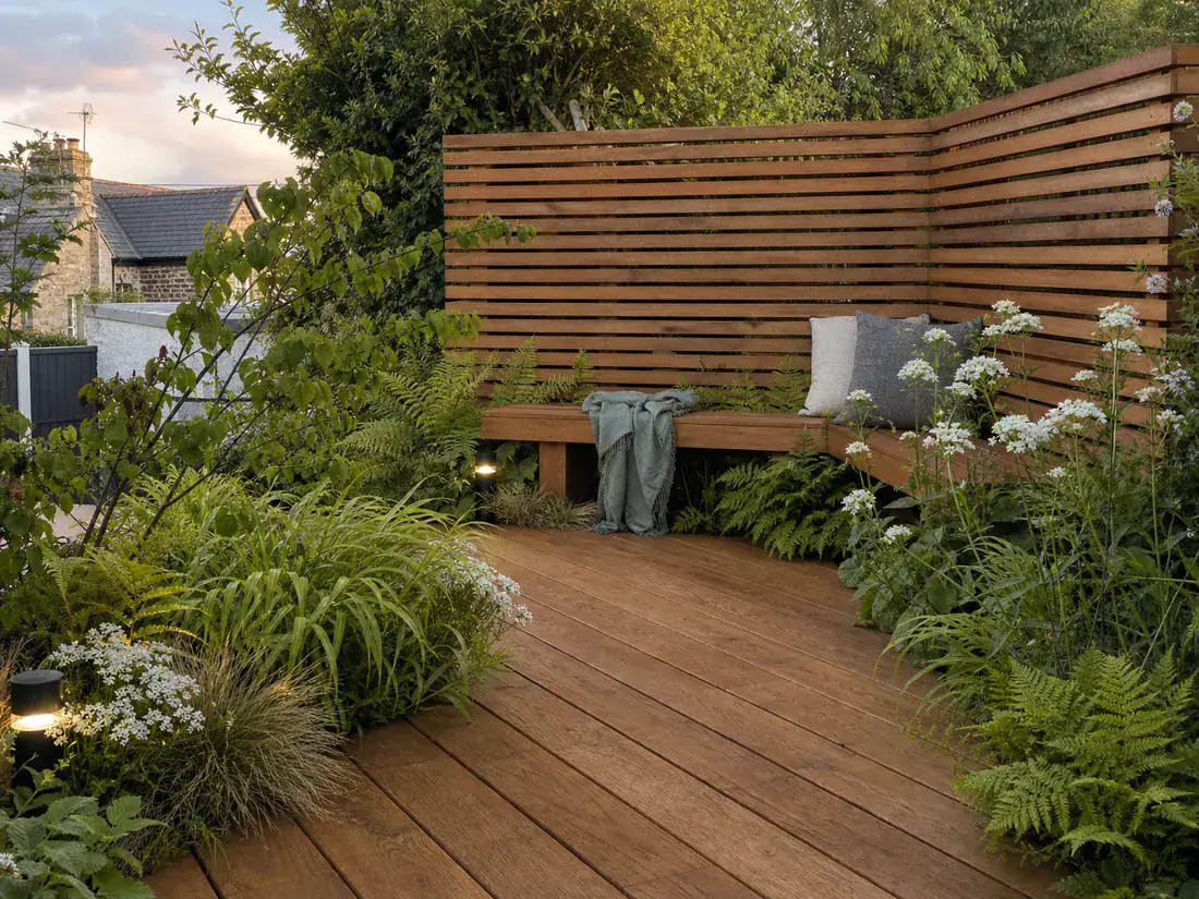Concept garden detail with timber decking, integrated seating and layered green planting